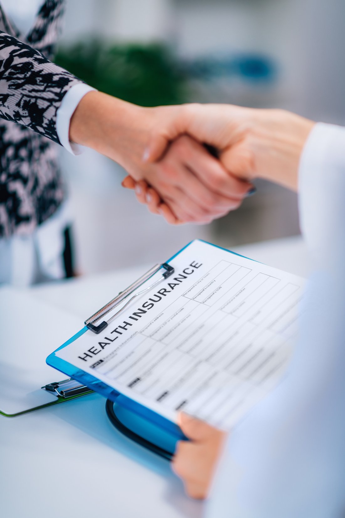 Handshake After Signing Health Insurance Form